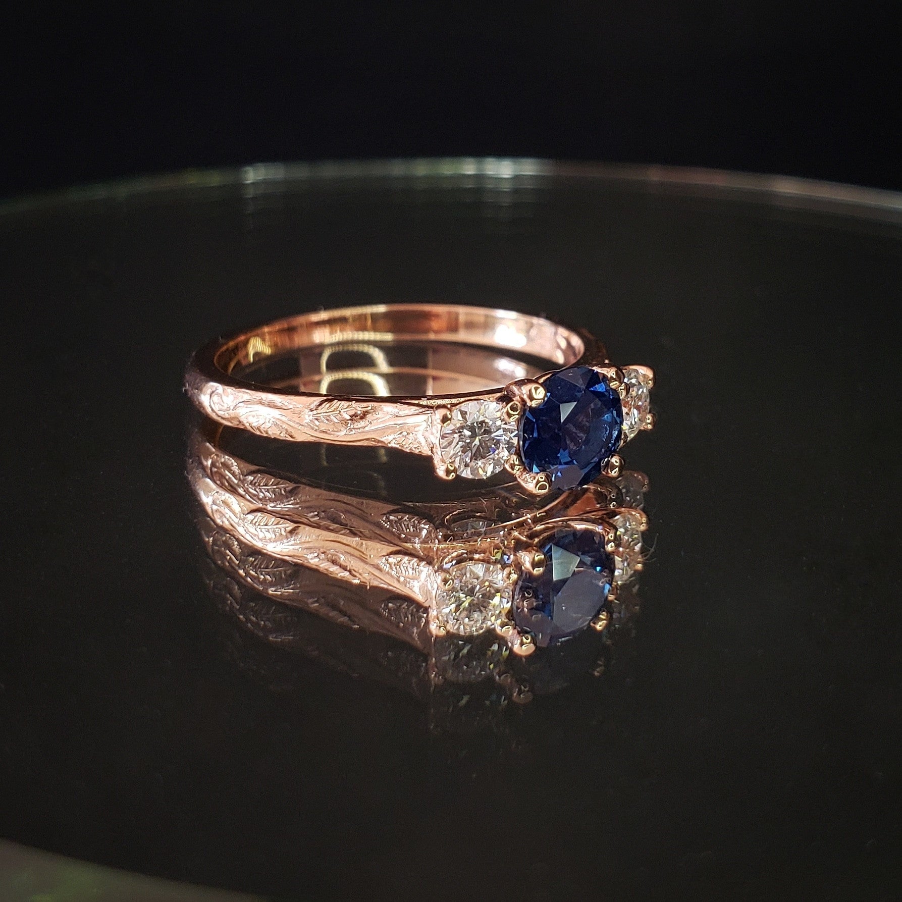Melitele Ring with Sapphire and Diamonds